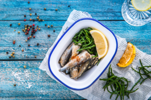 MSC Whitebait in a dish with samphire and lemon