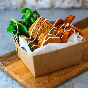 Mozzarella Bites served in a takeaway box with rocket and sweet potato fries