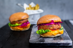 Butternut & Chickpea Burger in a fully-loaded bun with fries